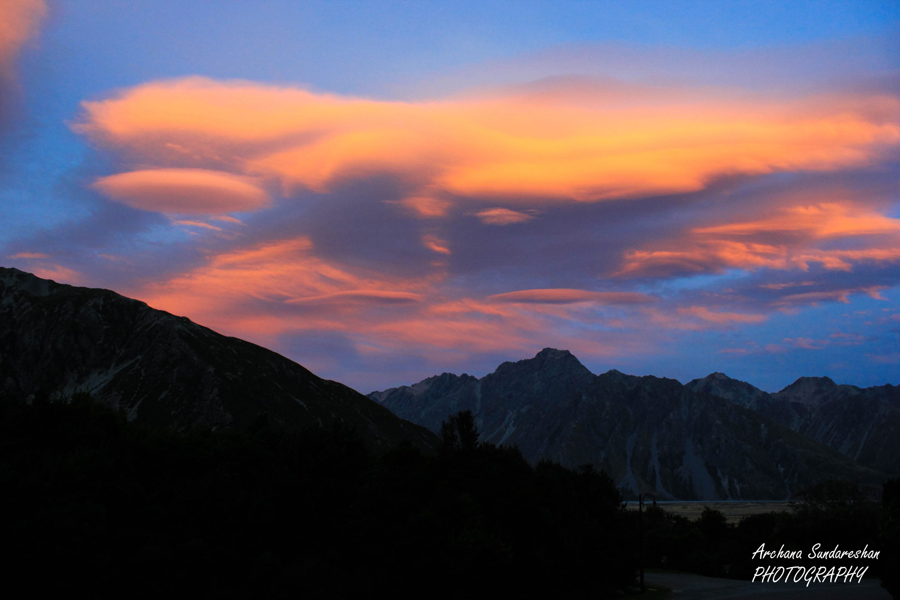 Sunrise at Aoraki Mount cook Village. Nature art in sky showing a man-woman kiss